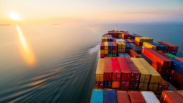Cargo ship at sunrise